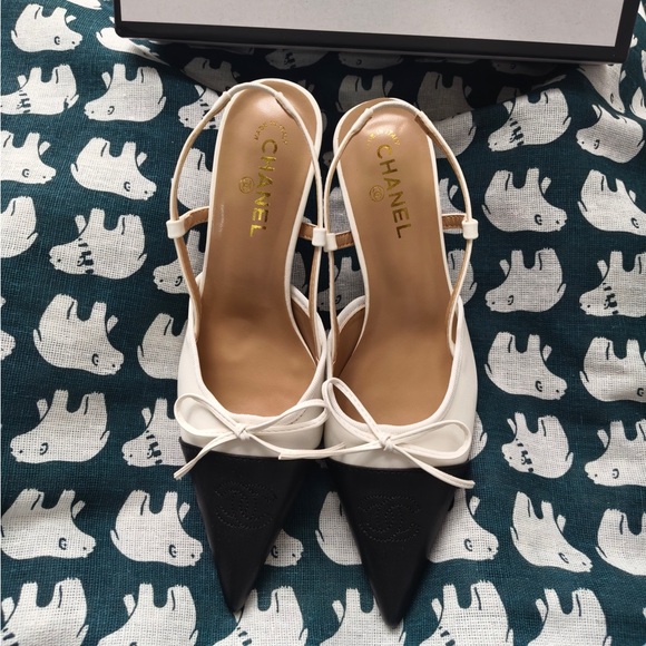 CHANEL Shoes - CHANEL Two-Tone White and Black Slingback Pumps with Bow